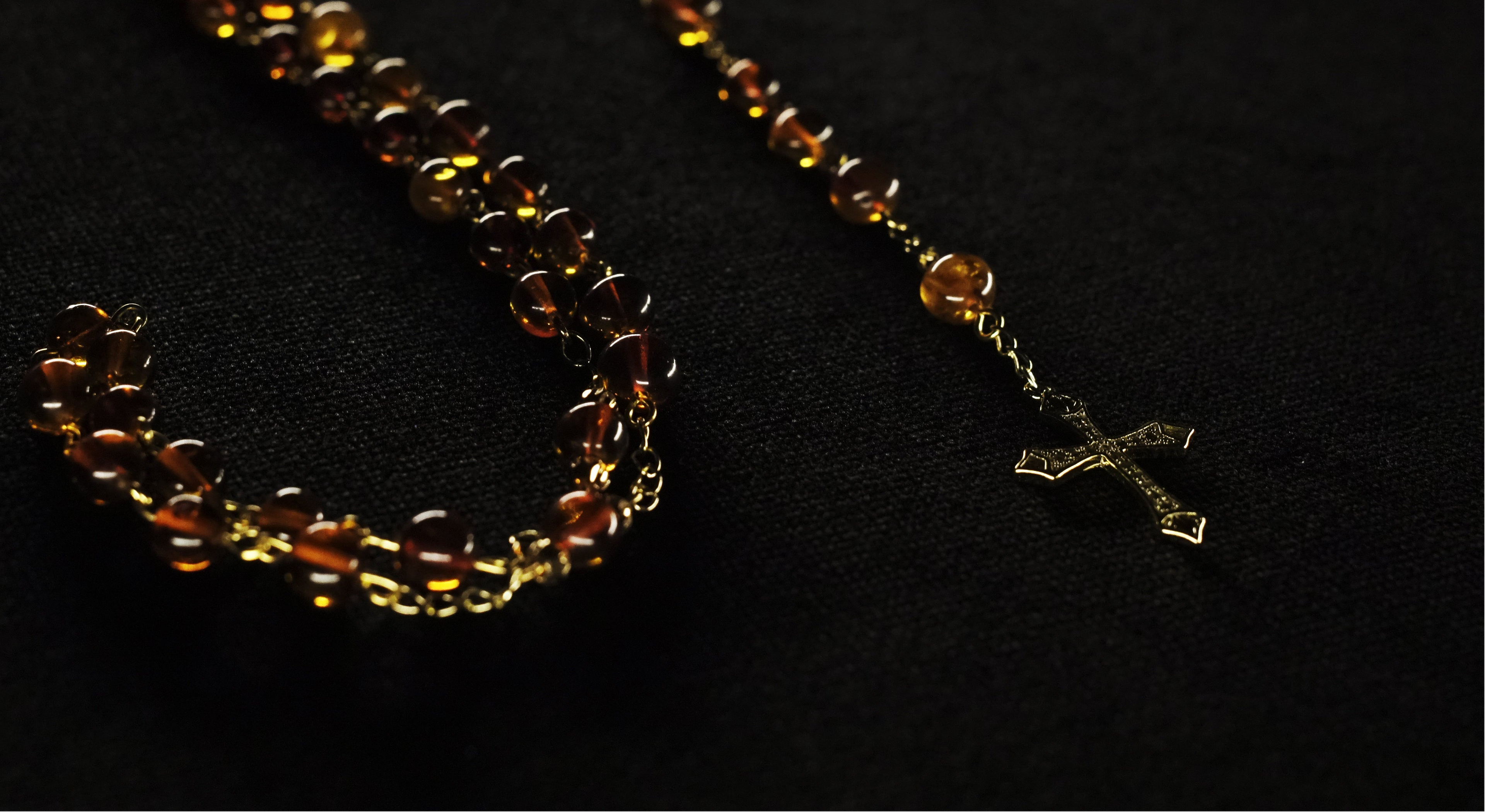 Discover our curated selection of amber rosaries. Each piece is crafted with meticulous attention to detail, using hand-selected Baltic amber beads, sturdy stainless steel connectors, and elegant sterling silver crosses.